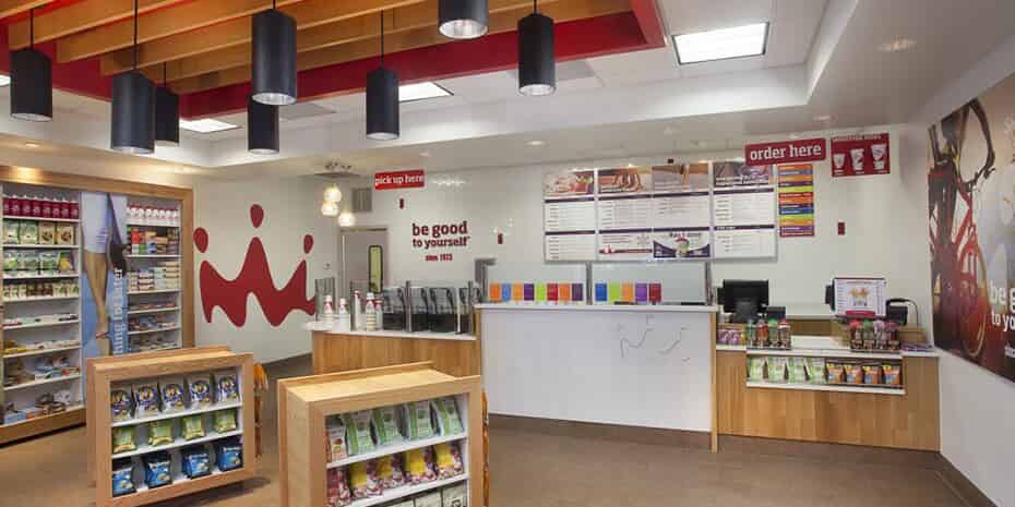 The evolving interior of a store with a variety of smoothie products.