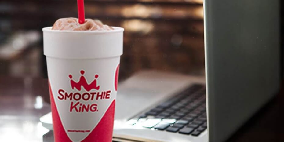 A smoothie and laptop combo illustrating key business metrics.