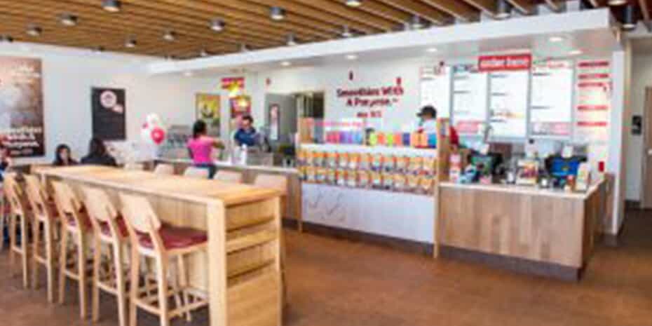 A fast food franchise with tables and chairs.