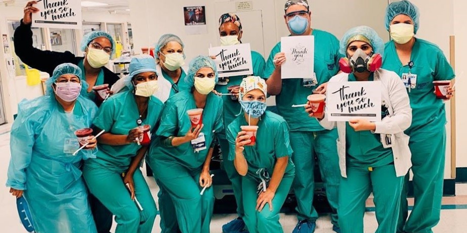 A group of nurses in scrubs posing for a photo as part of The Franchisees Behind the $1 Million Smoothie Donation Initiative.