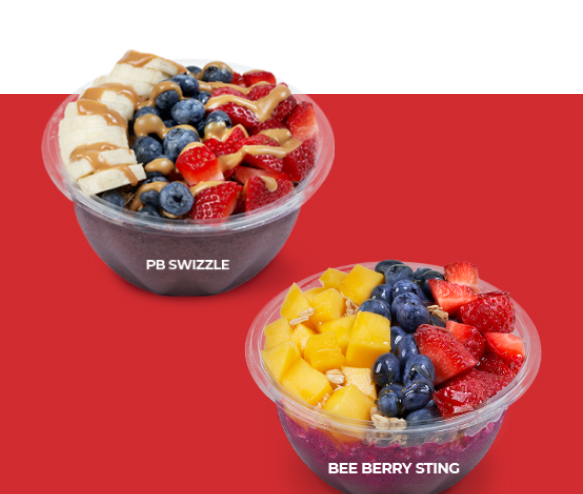 A franchise specializing in fruit smoothies featuring two bowls of fruit and berries.