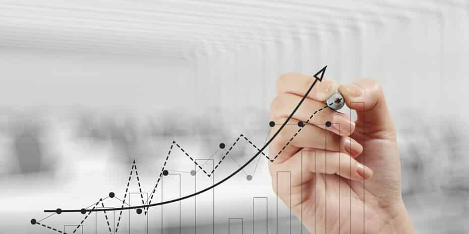 A hand graphing a healthy supply chain on paper.