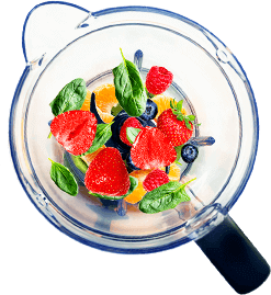A blender with berries and spinach in it, perfect for owning a smoothie shop.