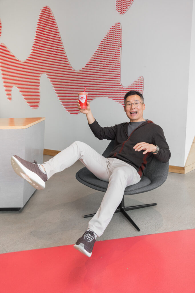 Wan Kim playfully falling with a Smoothie King cup